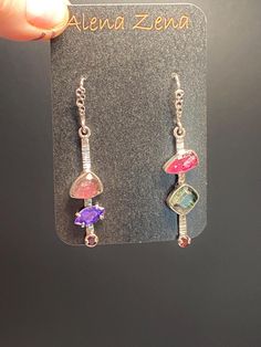 Mismatched Pink&Green Tourmaline with Amethyst and Garnet Earrings in sterling silver  Materials: Silver 925, Pink&Green tourmaline, Garnet, Amethyst  Height - 2", width - 3/8" Unique Handcrafted One-of a-kind Design Earrings Each Piece of Jewelry in my Collection is Absolutely One of a Kind! When you start wearing a piece of my jewelry you will fall in love with it more and more each day and feel that good Energy and Love that I pass into it while creating this piece of Art. A piece of Art crea Fusion Multi-stone Pink Jewelry, Fusion Style Dangle Jewelry As Gift, Handmade Tourmaline Dangle Jewelry, Silver Fusion Style Wire Wrapped Earrings, Multicolor Sterling Silver Fusion Earrings, Fusion Wire Wrapped Dangle Jewelry, Multicolor Fusion Sterling Silver Earrings, Tourmaline Dangle Earrings Perfect For Gifts, Dangle Multi-stone Earrings For Gifts