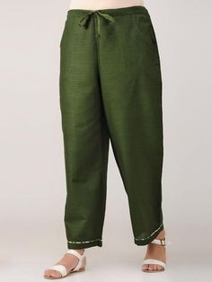 Green cotton satin pants with drawstring at waist and pockets. Features: Fabric-cotton satin Waist with drawstrings Highlight piping Handmade in India Garment measurements (in Inches): Size XS : Waist-26", Length-37" Size S : Waist-28", Length-37" Size M : Waist-30", Length-37" Size L : Waist-32", Length-37" Size XL : Waist-34", Length-37" Size XXL : Waist-36", Length-37" Size 3XL : Waist-38", Length-37" Size 4XL : Waist-40", Length-37" Fit: Model height - 5"7" Model is wearing a size S Fit - co Designers Dresses, The Secret Label, Ladies Pants, Dress Indian, Satin Pants, Dress Indian Style, Indian Style, Best Deal, Green Cotton