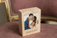 a wooden block with an image of a couple kissing