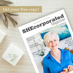 a magazine with an image of a woman in blue shirt on the cover and some soaps next to it