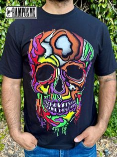 Handmade Serigraphy Print, Mexican Mens T-Shirts Graphic Tees that are super stylish , bright and glow in Blacklight , Neon Lights, Mexican Art Skull shirts , made by Artisans in Mexico in several designs . Mexican men Shirts. Short sleeve Men's apparel made of ultrasoft 100% cotton, this comfortable style is designed with a classic crew neckline, short sleeves and relaxed Fit, Our t-shirt is a perfect gift for that special person near you.  Please check the Product images for Size measurements guide Follow us in Instagram and Facebook: @RamposMX Black Rave T-shirt With Screen Print, Neon Graphic Print T-shirt With Crew Neck, Casual Neon T-shirt With Screen Print, Neon Cotton Crew Neck T-shirt, Black Cotton Rave T-shirt, Black Crew Neck T-shirt For Rave, Halloween Graffiti Print Crew Neck T-shirt, Artistic Multicolor Crew Neck T-shirt, Graphic Tee T-shirt With Skull Screen Print