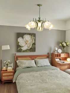 a bedroom with a bed, nightstands and painting on the wall above it's headboard