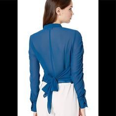 Draft Up A Look That Is Totally You With The Bebe Shirred Sleeve Blouse Soft And Stretchy Fabric Folded Collar Front Button Closure Long Sheer Sleeves With Button Cuffs Back Tie For Added Appeal 94% Polyester, 6% Spandex; Lining: 100% Polyester. Color: Blue Opal Size Small Nwt Versatile Fitted Blue Blouse, Blue Fitted Versatile Blouse, Fitted Blue Versatile Blouse, Versatile Blue Top With Button Closure, Blue Buttoned Top For Night Out, Blue Button-up Tops For Night Out, Versatile Blue Button-up Blouse, Chic Blue Top With Buttons, Chic Blue Tops With Buttons