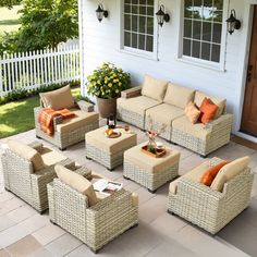 an outdoor living area with wicker furniture