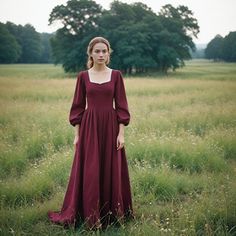 Embody elegance from another time in this ravishing burgundy medieval gown for women. This dress should be perfect for any Renaissance festival, Victorian theme events, and even historical cosplay because of its classic design and deep rich burgundy color. The flowing silhouette with a classic neck makes up the design for grace and royalty, suitable for any lady who wants to resemble these old charms. This dress is designed for comfort and durability, thus it is wear-worthy throughout the day at Medieval Clothing Female, Witch Dress Medieval, Red Medieval Dress, Medieval Women Dress, Historical Cosplay, Medieval Lady, Victorian Outfits, Day Gown, Victorian Theme