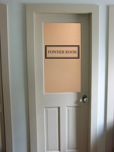 a door with a powder room sign on it