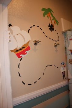 a child's bathroom decorated with pirate wall decals