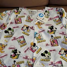 Disney Extra Large Top. Brand New With Tags! Fun White Mickey Mouse Tops, Themed White Tops With Character Print, Disney White Tops With Character Print, Christmas Scrub Tops, Disney Anniversary, Disney Tank Tops, Christmas Scrubs, Acid Wash Shirt, Disney Tanks