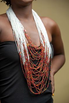 Unique African Maasai Handcrafted Beaded Necklace with an Elegant Look and Brilliant Finish. **GET FREE SHIPPING FOR ADDITIONAL ITEMS PURCHASED. Yes, Buy Multiple Items and pay shipping for 1 item only- The rest ships Free. (No Limits on the number of Multiple items). With a faster delivery time of 3 days via DHLExpress, Worldwide. Ordinary/Standard Shipping also available upon request. We Custom Make to Suit Your Taste. Available In All Colors and Sizes. For wholesale please chat me up for disc Bohemian White Beaded Necklaces With Dangling Beads, White Bohemian Beads For Festival, Bohemian White Beads For Festival, White Dangling Beads For Festival, Artisan White Beaded Chain, Festival White Dangling Beads, Traditional Multi-strand Beaded Necklaces, White Artisan Beaded Necklaces With Beaded Chain, White Beaded Necklaces With Dangling Beads For Festivals