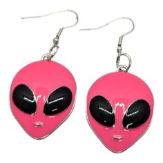 pair of pink alien earrings with black and white faces on them, hanging from silver hooks