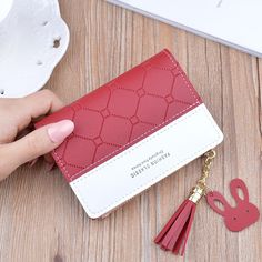 Brand Name: HEONYIRRYMain Material: PUOrigin: CN(Origin)Wallet Length: ShortItem Weight: 0.09kgLining Material: PolyesterItem Height: 9cminchMaterial Composition: pu leatherPattern Type: PatchworkStyle: CasualModel Number: B741Interior: Interior Slot PocketInterior: Interior Zipper PocketInterior: Interior CompartmentInterior: Zipper PouchtInterior: Coin PocketInterior: Note CompartmentInterior: Photo HolderInterior: Card HolderItem Width: 1.5cmGender: WOMENItem Length: 12cminchItem Type: Wallet Mini Money, Simplicity Fashion, Bill Holder, Patchwork Fashion, Zipper Purse, Short Wallet, Money Bag, Mini Wallet, Pink Mini