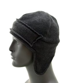 "For those brutal cold days protect your head and ear with this snuggle ear flap hat. This hat is made from soft stretch polar fleece, also lined with fleece making it super warm. A 2.5\" high strip is stitched to the front to keep the forehead extra warm. The height of the hat is 9\" (not including the ear flap), and is custom made to your head size. You can select your head size from the drop down box. * 100% Polyester * Self Lined * Hand/Machine Wash * Handmade in USA" Adjustable Cap With Plush Lining, Adjustable Hats With Fleece Lining For Winter Sports, Adjustable Fleece-lined Hats For Winter Sports, Adjustable Winter Sports Hats With Fleece Lining, Adjustable Windproof Beanie For Outdoor Activities, Wool Hats With Ear Flaps For Outdoor, Casual Beanie With Ear Flaps For Outdoor, Outdoor Beanie With Fleece Lining, Adjustable Windproof Gray Hat