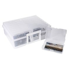 two plastic storage boxes with lids and dividers on each side, one holds several cards