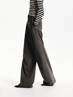 MO&Co. Women's Pleated Wide Leg Pants Crafted from well-done fabric, these wide-leg pants have been designed to fall loosely over the body. With convenient side slip pockets and a front pleated design that creates a flattering silhouette. Features : - Relaxed wide-leg silhouette- Side slip pockets, back welt pockets- Front pleated design Code: MBD3PATT03The back length of size M is 108cmMATERIALS & CARE Material: 66.8% Polyester 30.9% Viscose 2.3% SpandexPlease put it into a mesh bag to wash.REM Pleated Wide Leg Pants, Mesh Bag, Welt Pockets, The Body, Welt Pocket, Leg Pants, Wide Leg Pants, Black Pants, Black And Grey