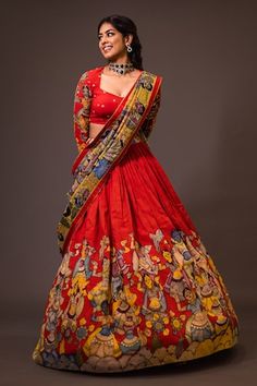 Red attached cancan lehenga with ajantha concept kalamkari hand painted patterns. Paired with  padded red blouse embroidered with glass beads and green hand painted dupatta with contrast border. - Aza Fashions Kalankari Lehangas Blouse Design, Chikankari Lehenga With Kalamkari Dupatta, Birthday Traditional Outfits, Mangalgiri Half Saree, Kalamkari Lehangas Designs, Penkalamkari Lehanga, Pen Kalamkari Blouses, Pen Kalamkari Lehangas, Kalamkari Half Saree Designs