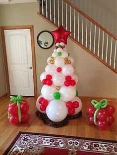 a christmas tree made out of balloons on the floor