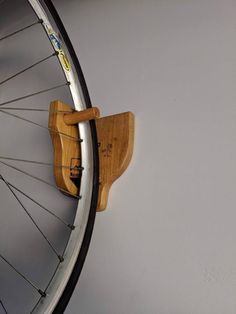 there is a bike wheel hanging on the wall