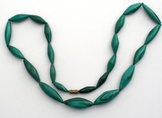 Gemstone Jewelry - This is a vintage green malachite bead necklace with a barrel clasp. The necklace is 18" long, widest bead is .38" wide. The length of the beads vary from .75" to 1". Formal Green Single Strand Beaded Necklace, Vintage Green Oval Beads Jewelry, Vintage Green Oval Beaded Jewelry, Vintage Green Beaded Necklaces With Oval Beads, Vintage Green Oval Bead Necklaces, Green Beaded Necklace With Large Oval Beads, Vintage Green Beaded Necklace With Oval Beads, Vintage Green Oval Beaded Necklaces, Elegant Green Beaded Necklaces With Wooden Beads