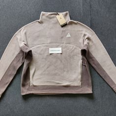 Women's Nike Acg Therma-Fit Wolf Tree Polartec Fleece Pullover Size L (Moon Fossil/Olive Grey/Summit White). Brand New With Tags, Never Tried On. Comes From A Smoke-Free Home. Fast Free Shipping Via Usps Priority Mail. Measurements (Approx.) Chest Across 25 Inches Length 24inches Sleeves 22 Inches Midweight Fleece Long Sleeve Tops, Midweight Fleece Tops For Winter, Midweight Long Sleeve Winter Sweatshirt, White Ski Jacket, Black Winter Jacket, Brown Zip Ups, Snow Skirt, Polartec Fleece, Nike Acg Jacket