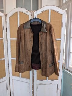 Soft leather suede in a light chocolate brown. Button closure and removable lining to take this piece from fall to winter to spring. In good condition with some wear at the edges. 17 inches across the shoulders, 22 inches across the chest. 24 inches long. Fall Suede Leather Jacket With Suede Lining, Brown Leather Jacket With Suede Lining, Brown Leather Jacket With Suede Lining For Work, Classic Brown Outerwear With Suede Overlays, Brown Suede Leather Jacket For Work, Brown Leather Jacket With Suede Overlays, Classic Brown Leather Jacket With Suede Lining, Brown Leather Outerwear With Buttons, Brown Leather Jacket With Suede Lining For Winter