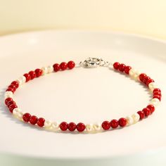 Red Coral and Freshwater Pearl Beaded Necklace, Red Coral Gemstones, Genuine Coral, Natural Freshwater Pearls, Summer Choker, Gift for Her Materials: Bamboo Coral, Natural Freshwater Pearl, Stainless Steel Beads Size: approximately 5mm Closure: Spring Clasp ----------------------------------------------------------------------------------------------- ❤SHIPPING Processing Time: 1-3 days Shipping Day: Monday, Wednesday, Friday USPS Ground Advantage(within the U.S ): 2-5 business days *Free shippi Red Pearl Necklaces For Valentine's Day, Red Single Strand Beaded Bracelet, Red Pearl Necklace With Gemstone Beads, Adjustable Red Pearl Necklace, Red Pearl Bracelets With Round Beads, Red 8mm Beaded Jewelry For Valentine's Day, Red Pearl Jewelry With Polished Beads, Red Pearl Necklace With Polished Round Beads, Red Polished Pearl Necklace