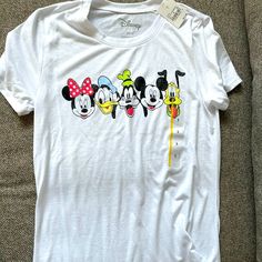 New With Tags Disney Shirt Spring Cotton Mickey Mouse Top, Spring Mickey Mouse Cotton Top, White T-shirt For Disney Trips In Summer, White Disney Tops For Summer, Casual Mickey Mouse T-shirt For Spring, Spring Mickey Mouse Short Sleeve Top, Mickey Mouse Shirt For Disney Fan Events In Summer, Cute White Tops For Disney Trips, White Crew Neck Top For Disney Trips