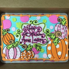 there is a cake in the box that says happy mother's day and pumpkins