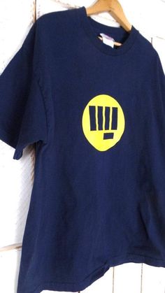 "90s dark blue/yellow graphic print t shirt/blue graphic print tee Measurements...taken flat -marked size: xlarge -chest: 22.5\" (57.2 cm) -length: 31\" (78.8 cm) Condition... -excellent vintage condition -minor wear TG834" Retro Blue T-shirt With Front Print, Blue Retro T-shirt With Front Print, Vintage Blue T-shirt With Front Print, 90s Blue Logo Print T-shirt, Yellow Graphic Tee, Travel Tees, Blue Graphic, Tee Shirt Print, Print Tee