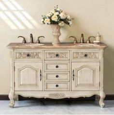 an antique style bathroom vanity with two sinks