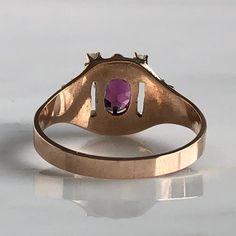 Details: Beautiful Victorian Garnet and Seed Pearl ring set in lovely 14K rose gold. The band is adorned in lovely abstract filigree engraving. The stone has great depth, and has a lovely rich pink tint to the garnet. It is surrounded by 4 seed pearls. The garnet measures 7.5mm x 5mm. There are no internal markings. Measurements: Ring measures a size 7 3/4 US. It can be re-sized for a fee. Condition: The overall all condition of this ring is very good. Please ask all questions prior to placing a Wedding Rose Gold Ruby Ring With 17 Jewels, Fine Jewelry Rose Gold Oval Signet Ring, Fine Jewelry Rose Gold Rings Stamped 14k, Rose Gold Oval Signet Ring In Fine Jewelry Style, Oval Rose Gold Signet Ring In Fine Jewelry Style, Oval Rose Gold Signet Ring Fine Jewelry, Rose Gold Rings, Stamped 14k, Fine Jewelry, Rose Gold Signet Ring With Rose Cut Diamonds, Rose Gold Oval Engraved Ring Fine Jewelry