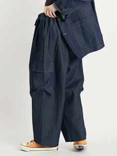 Editor's NotesThese balloon pants are built with room to move, and relaxed through the hip and thigh, with a full leg.These cargo pants are made with cotton.- Side pockets- Balloon cargo pants with elastic waistband- Wide leg pants- Pintuck design on the bottom of the pants Measurements(in.)One size- Total length: 37.8in.- Waist: 13.39 to 20.08in. - Hips: 27.47in.- Thigh: 17.39in. - Front rise: 16.6in.- Leg opening: 10.24in.Model Size Woman Height - 5’ 57”Weight - 110lbM Denim Blue Tapered Leg Cargo Pants, Loosely Fitted Cargo Jeans With Tapered Leg, Baggy Indigo Jeans With Pockets, Baggy Indigo Bottoms With Pockets, Indigo Wide-leg Pants With Pockets, Denim Blue Tapered Pants With Side Pockets, Utility Baggy Jeans For Workwear, Baggy Tapered Leg Utility Bottoms, Tapered Leg Denim Blue Cargo Pants