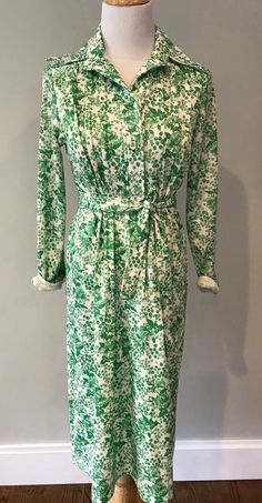 Super cute vintage floral shirtdress -green and white. Covered bottoms.  Size med/ large-  chest measurement is 17 across.  Good condition- fully lined . Collared Dresses For Spring Garden Party, Green Long Sleeve Shirt Dress For Daywear, Spring Green Button-up Shirt Dress, Collared Floral Print Shirt Dress For Day Out, Green Fitted Midi Shirt Dress, Green Cotton Shirt Dress For Daywear, Spring Floral Print Shirt Dress, Spring Floral Print Collared Dress, Floral Print Collared Dress For Spring