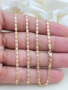 "Beautiful solid 14k yellow gold Valentino Star Diamond Cut chain. Perfect for everyday and every occasion. Elegant, unique and everlasting. Perfect for gift. 14k gold will not tarnish or rust. Materials: 14k solid yellow gold. Length: Available in 16 to 24 Inches. Thickness: 2.1mm. Weight: 16''= 2 grams - 18''= 2.2 grams - 20''= 2.3 grams - 22''=2.6 grams - 24''= 2.8 grams. (ALL WEIGHTS ARE APROXIMATE). Brand New. 14k gold stamped. The chains in the video are 16\", 18,\" and 20\" Inches :) Foll Gold Oval Link Jewelry With Diamond Cut, Yellow Gold Link Jewelry Stamped 14k, 14k Gold Diamond Cut Link Jewelry, Stamped 14k Link Chain Necklace Gift, 14k Stamped Link Jewelry For Gift, Hallmarked 14k Gold Jewelry With Rectangular Links, 14k Link Chain Necklace As Gift, 14k Gold Diamond Cut Chain Necklace For Anniversary, 14k Gold Chain Necklace With Diamond Cut