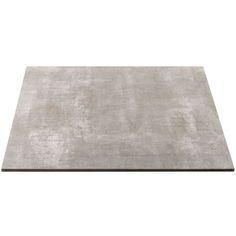 a gray rug on top of a white floor with no one in the room around it