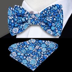 This silk bow tie, adorned with a delicate small floral pattern, comes in shades of green, blue, or red, offering a refined and vibrant accessory for a range of formal and semi-formal occasions. The subtle floral detailing brings a touch of personality while maintaining a classic and elegant feel. Dress Shirts: White dress shirt: A timeless white shirt serves as the perfect canvas for any shade of this floral bow tie, allowing the green, blue, or red hues to stand out while keeping the look cris Elegant Summer Bow For Gifts, Elegant Spring Bow Tie With Butterfly Knot, Elegant Bow Tie Suit Accessories For Spring, Elegant Bow Tie Suit And Tie Accessories For Spring, Summer Formal Suit And Tie Accessories With Floral Print, Elegant Floral Print Accessories For Black Tie, Elegant Blue Bow Tie For Spring, Elegant Spring Bow With Ties, Blue Bow Tie For Summer Business Events