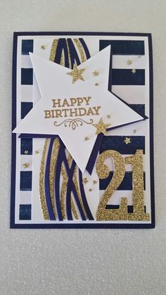 a birthday card with the number twenty five in gold and blue, on a white background