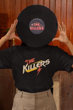 The Killers t shirt design  Made from 100% organic ring-spun cotton, this unisex t-shirt is a total must-have. It's high-quality, super comfy, and best of all--eco-friendly. * 100% organic ring-spun cotton * Fabric weight: 5.3 oz./yd.² (180 g/m²) * Single jersey * Medium fit * Set-in sleeves * 1 × 1 rib at collar * Wide double-needle topstitch on the sleeves and bottom hems * Self-fabric neck tape (inside, back of the neck) * Blank product sourced from China or Bangladesh The sizes correspond to Black Pop Culture T-shirt For Music Festivals, Unisex Black Music-themed T-shirt, Black Graphic T-shirt For Music Festivals, Black Music-themed T-shirt, Black T-shirt With Heat Transfer Vinyl Band Merch, Black Music-themed Fan Merchandise T-shirt, The Killers Concert, The Killers Band, Rock Band Shirts