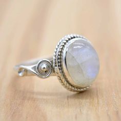 Moonstone Oval Cabochon Ring, Spiritual Moonstone Oval Cabochon Ring, Oval Moonstone Crystal Birthstone Ring, Oval Moonstone Crystal Ring Birthstone, Moonstone Gemstone Ring In Oval Cabochon Shape, Moonstone Oval Cabochon Gemstone Ring, Oval Moonstone Ring With Natural Stones, Oval Moonstone Crystal Ring With Gemstone, Oval Moonstone Crystal Ring With Natural Stones