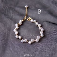 Handmade White Freshwater Pearl Beaded Bracelet by JustPearlfect Adjustable Pearl Bracelet With Pearl Drop And Round Beads, Adjustable Pearl Drop Bracelet, Beaded Pearl White Round Bracelet, Elegant Pearl White Beaded Bracelets With 8mm Beads, Pearl White Beaded Round Pearl Bracelet, Gold Pearl Bracelet With Pearl Chain, Adjustable Pearl Bracelet With Round Beads, Pearl White Beaded Bracelets With Pearl Chain As Gift, Pearl Bracelet With Round Beads And Pearl Charm