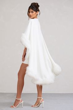 Tickle every wedding guest this season in our fluffy mini dress. Of The Manor. Crafted in luxurious crepe fabric in a silhouette designed to showcase your curves. this white bodycon dress features a crew neckline and a short cape trimmed with soft faux feathers. Of The Manor would look especially sweet styled with white stilettos and large gold hoops. Features - Premium stretch crepe- Crew neckline- Gathered waistline- Bodycon fit- Invisible zip closure - Cape sleeves- Mini length Sizing & FitMo Fluffy Mini Dress, Faux Feathers, Feather Cape, White Stilettos, Black Dress Prom, Black Tie Gala, White Bodycon, White Bodycon Dress, Party Dress Long Sleeve