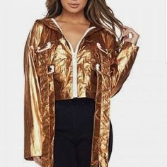 Edgy And Fun This Gold Metallic Jacket Will Be Your Fav!! Jacket Features: -Long Sleeves -Flap Front Pockets With Buckle Closure Detailing, -Metallic Finish -Contrast Zip-Up Closure, -Semi Cropped Length, -Hooded -Material Polyester Model Is 5’8 Wearing A Size Small (Waist: 24”, Bust: 32b, Hips: 34”) True To Size S=4/6 M=8/10 L=10/12 Fit: Loose As Seen On Model Trendy Gold Outerwear For Party, Trendy Gold Party Outerwear, Trendy Hooded Outerwear For Party, Metallic Outerwear For Party, Trendy Gold Outerwear For Fall, Chic Gold Outerwear For Fall, Casual Metallic Outerwear For Party, Trendy Metallic Outerwear For Fall, Chic Gold Long Sleeve Outerwear