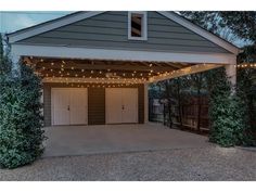 an attached garage with lights on the roof