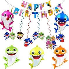 a bunch of balloons that are shaped like shark's and sharks with the words happy birthday on them