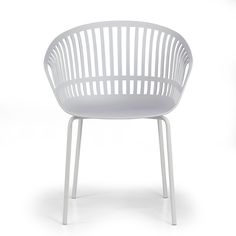 a white plastic chair sitting on top of a white floor