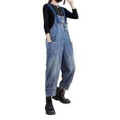 Introducing the 2023 Spring-Summer Collection ââ‚?Street Style Women's Denim Jumpsuit. the perfect blend of laid-back style and conventional sophistication! Take your look to the next level with this unique piece. crafted to embody the essence of rebellion and quintessential vogue.Why They're Your Next Statement PieceFeaturing a slouchy fit with suspenders closure. these denim jumpsuits offer a medium wash and edgy distressed pattern that's sure to make a statement. Not just a jumpsuit. but an a Blue Baggy Straight Leg Overalls, Baggy Blue Straight Leg Overalls, Denim Wide Leg Jumpsuits For Summer, Denim Wide-leg Jumpsuits And Rompers For Summer, Summer Denim Wide Leg Jumpsuits And Rompers, Summer Wide Leg Denim Jumpsuits And Rompers, Denim Blue High Waist Jumpsuit With Pockets, Dark Wash Wide Leg Jumpsuits And Rompers With Pockets, Wide Leg Denim Jumpsuit With Pockets