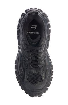 Balenciaga presents the monster-truck of sneakers with this bold style featuring a layered upper and a superchunky sole with extreme tire-inspired tread. Lace-up style Removable insole Synthetic and textile upper and lining/rubber sole Imported Men's Designer Shoes Balenciaga Defender, Balenciaga Shoes Women, Black Shoes Outfit, Rubber Sneakers, Black Balenciaga, Balenciaga Sneakers, Balenciaga Mens, Balenciaga Black, Mens Designer Shoes