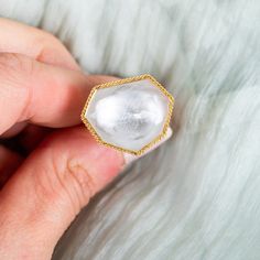 This enchanting Rock Crystal ring has a smokey grey and white wash swirling beneath its surface. We honored this gemstone with a meticulously handmade gold frame accented with braided gold. Ready to ship in size 7. Please allow 1-2 weeks for any other size. Technical Details Metal: 18k yellow goldRock Crystal: 17.82 cts. Ring face: 19 x 22.5mmBand width: 2mmHandmade in New YorkStyle # R-2524-RC Handmade Gold, Rock Crystal, Crystal Rings, Gold Frame, Grey And White, Swirl, Crystals, Gemstones, Gold