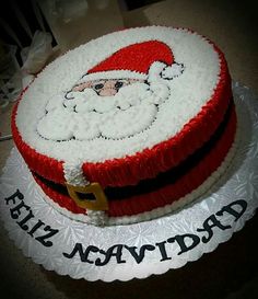 a santa clause cake on top of a white plate