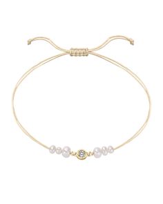 Adorn yourself in luxurious beauty with our Half Natural Pearl String of Love Bracelet. We've taken the timeless elegance of lustrous white pearls and combined them with our String Of Love bracelet to create a piece that's perfect for stacking or wearing solo as the main event. With three round natural pearls lined up beautifully next to an ethically sourced diamond, you'll be able to show off your refined taste while adding some extra shine to any outfit. A pearl of wisdom from the Magal Team -