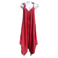 "A VERY popular style.  We sell so many of these.  Oversized so One size fits all and they are so fun to wear.  Adjustable tie straps.  Great summer coverup at the beach or just about anywhere.  Made in top quality rayon.  Hand dyed Super comfortable too. A matching tie belt is included. * SIZE: THESE ARE TAGGED OS. USUALLY FITS S M L XL 1X 2X 3X POSSIBLY LARGER. * MEASUREMENTS : Bust: 60\" , Hip: 96\", Length : 55'' * FABRIC: RAYON * MADE IN: BALI, INDONESIA" Red Cotton Beach Jumpsuits And Rompers, Red Cotton Jumpsuits And Rompers For Beach, Red Cotton Jumpsuit For The Beach, Bohemian Red Jumpsuits And Rompers For Beach, Red Sleeveless Overalls For Summer, Red Sleeveless Summer Overalls, Red Cotton Summer Overalls, Red Cotton Overalls For Summer, Summer Cover Up